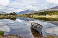 Five boats in tranquil water near Moll's Gap